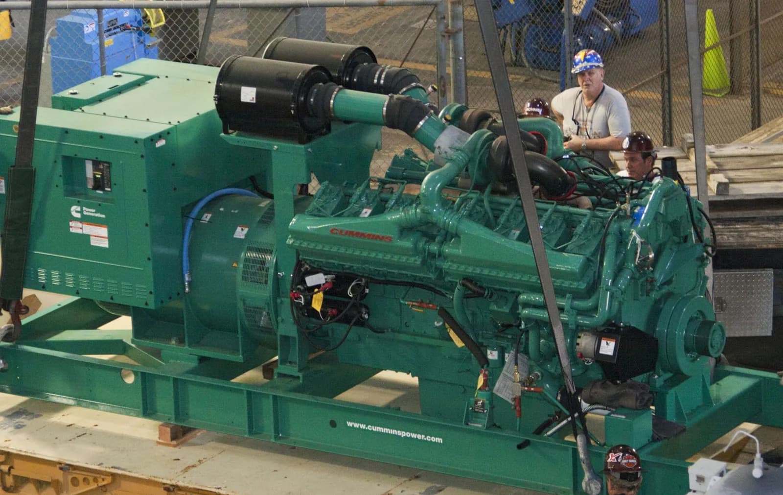 Large open Cummins V-engine generator set on a steel base frame