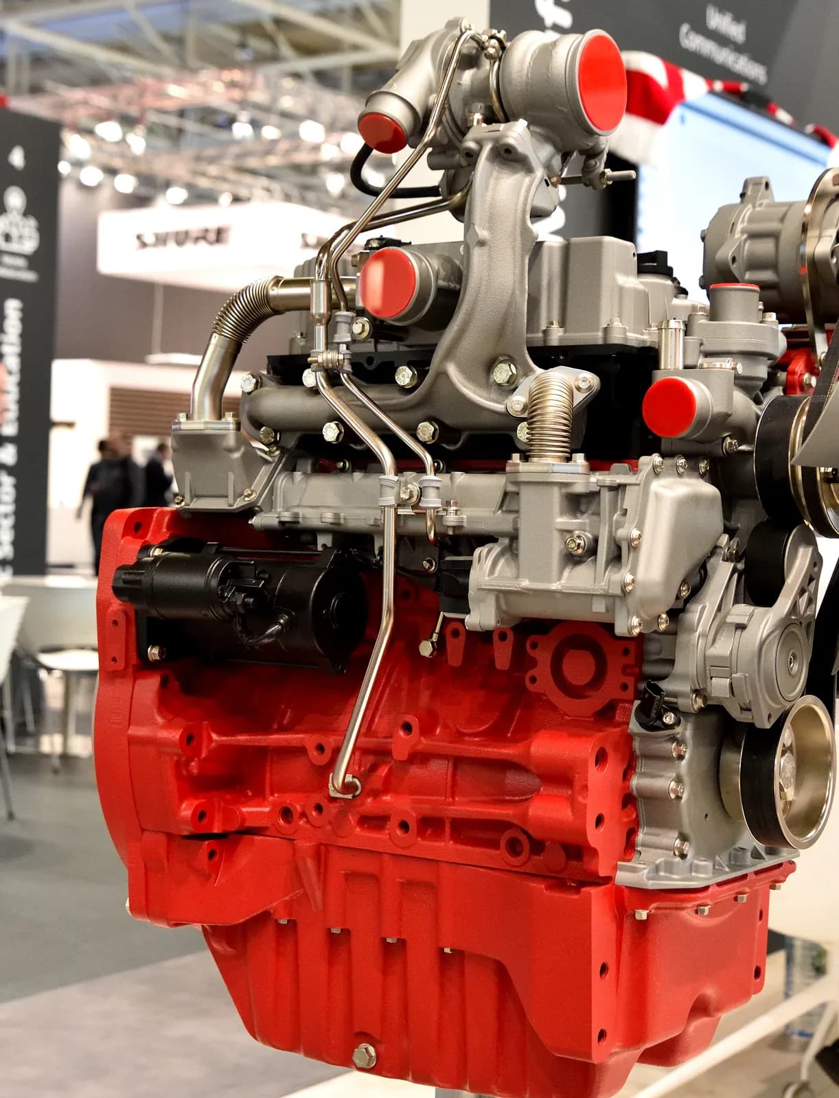 Deutz TCD four-cylinder industrial diesel engine on a display stand