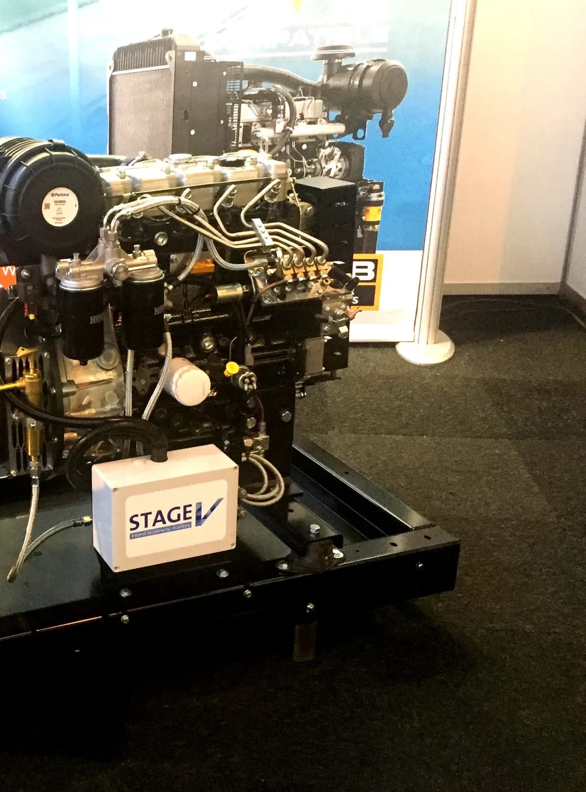 Small Perkins 400-series engine coupled to an alternator on an open base frame